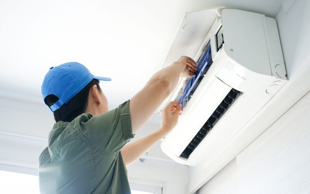 HVAC technician servicing a ductless mini split in Fountain Valley