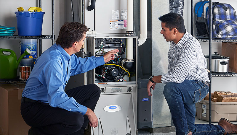 Technician evaluating a furnace for repair or replacement in Fountain Valley