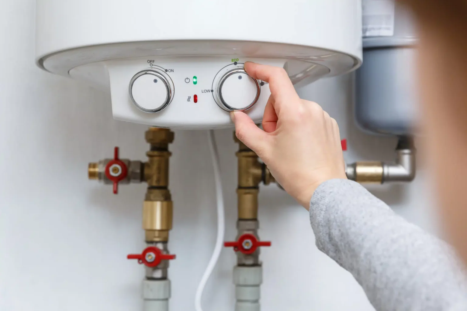 Technician adjusting a water heater in Fountain Valley